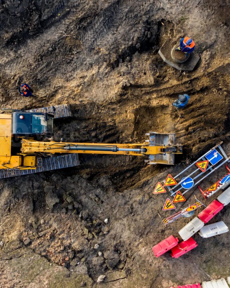 Overhead view of an excavator digging in the dirt